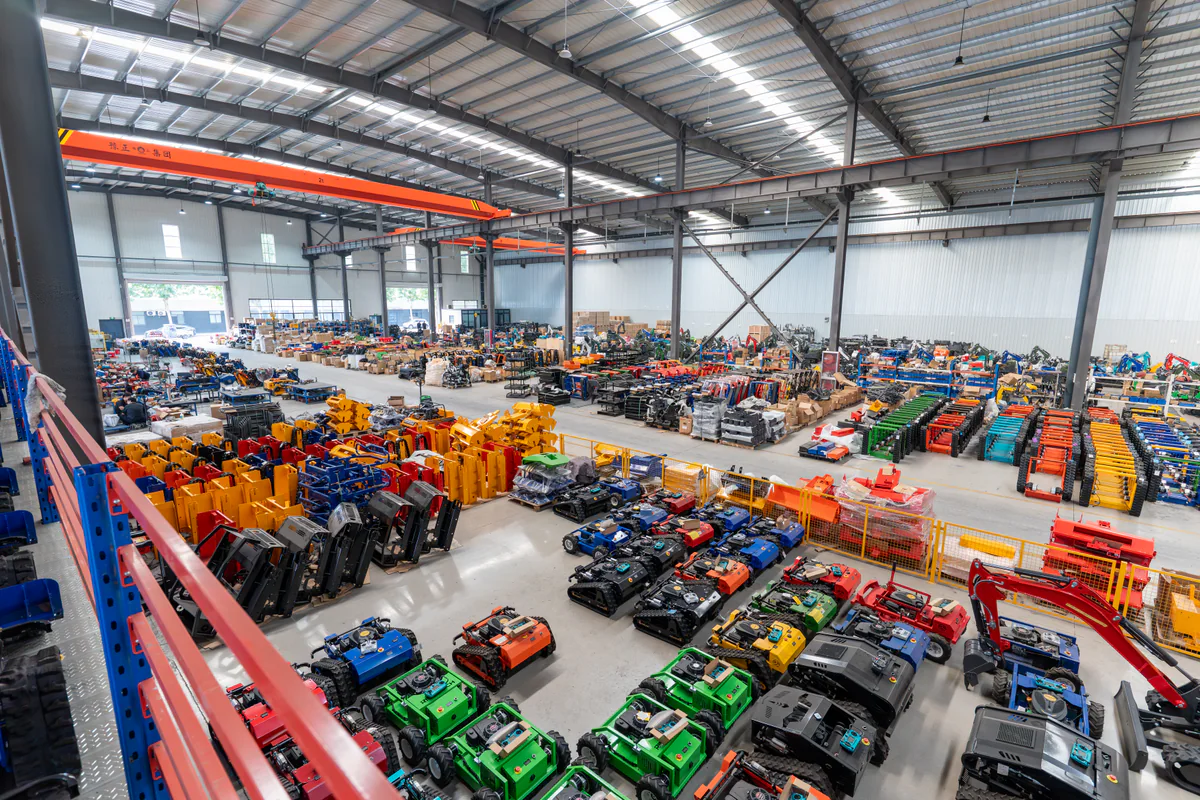 A wide view across the AVYARD factory floor, with machinery displayed throughout the production hall.