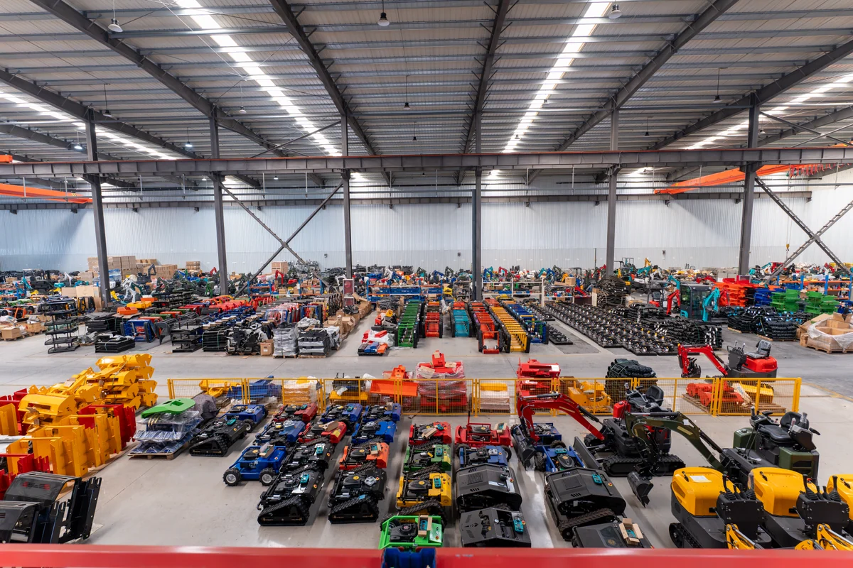 A wide view across the equipment-filled factory production floor.