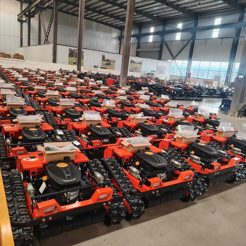 Rows of orange mower units inside the workshop.
