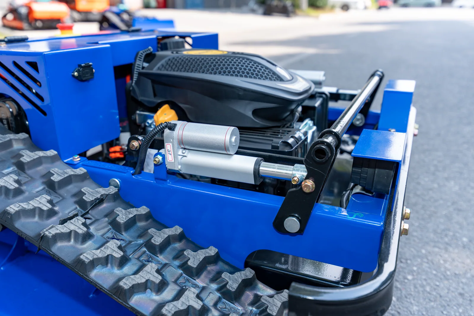 AY-500 cutting-deck lift mechanism beside the track assembly