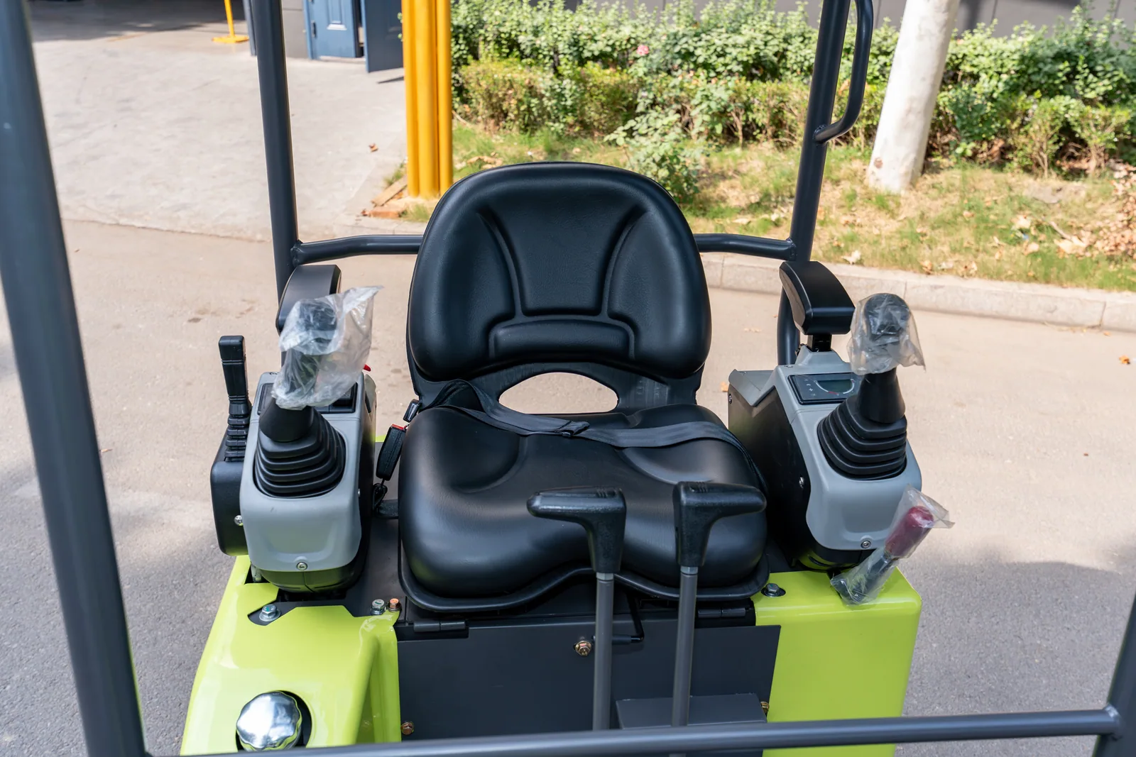 AY18 operator seat and paired control joysticks