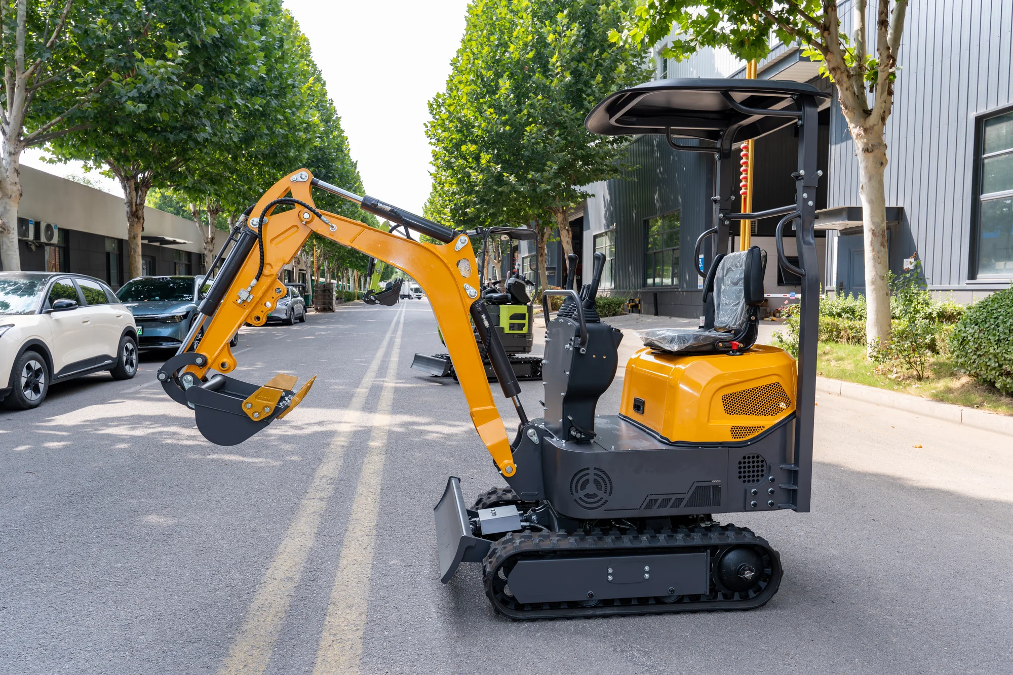AY12 mini excavator photographed outdoors on paved ground