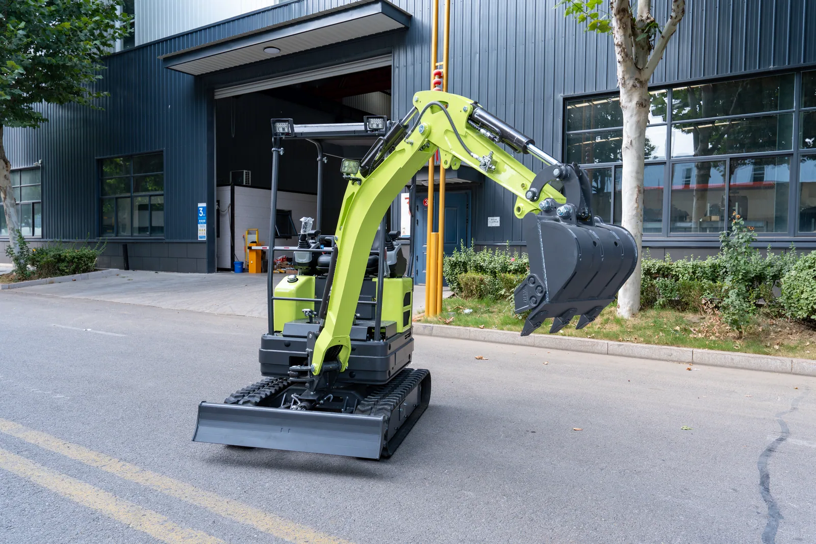 AY18 mini excavator photographed outdoors on paved ground